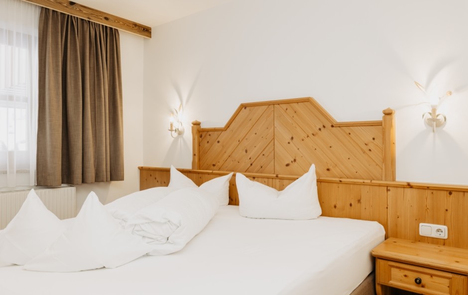 Bett im Doppelzimmer L